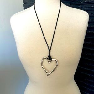 Silver colored metal hammered heart necklace